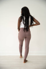 PURPOSE active joggers in Mauve with two front pockets, coated drawstrings at waist, and banded hems.