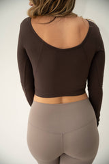 Chocolate brown long sleeved active crop top in buttery soft brushed fabric.