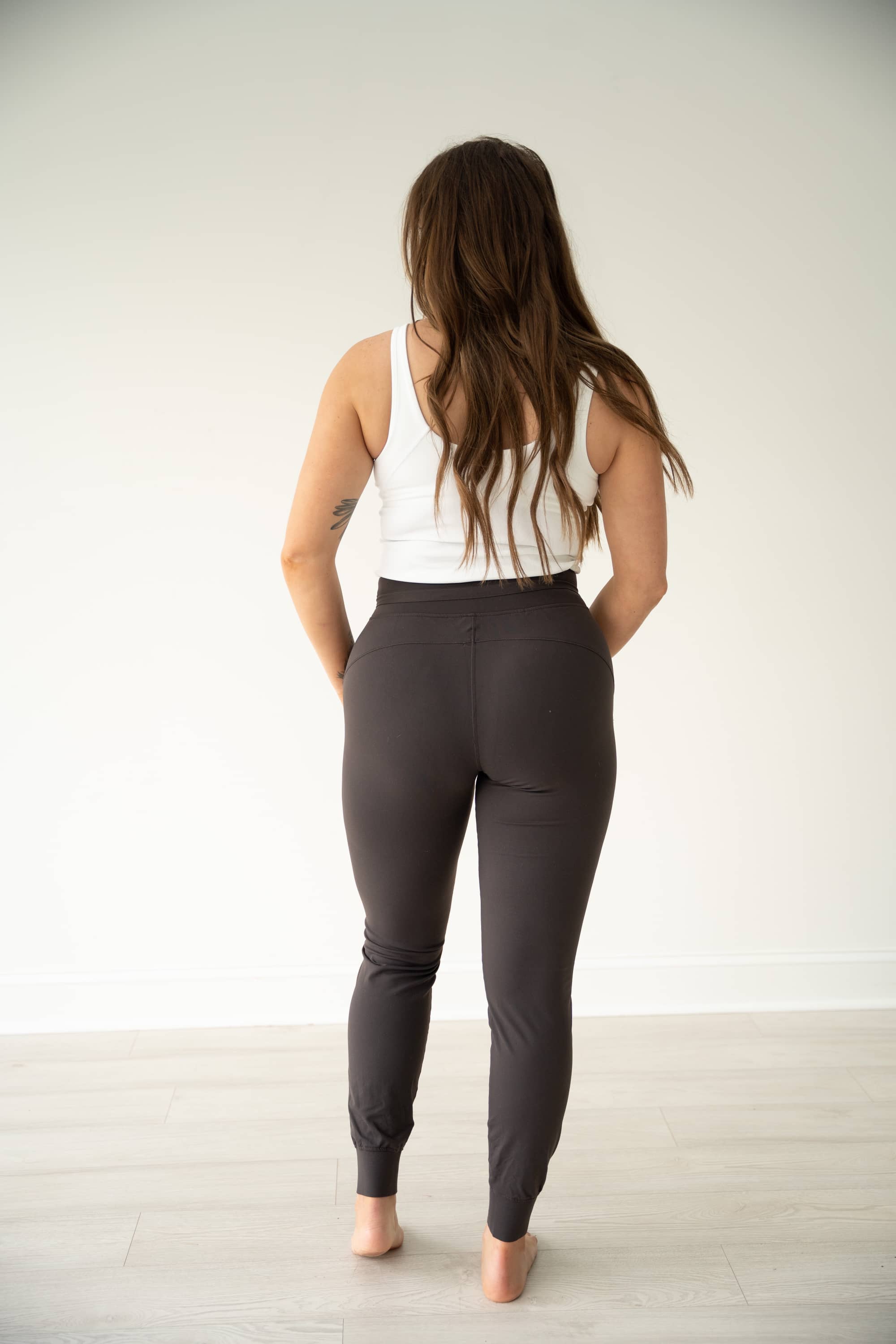 PURPOSE active joggers in Gray with two front pockets, coated drawstrings at waist, and banded hems.