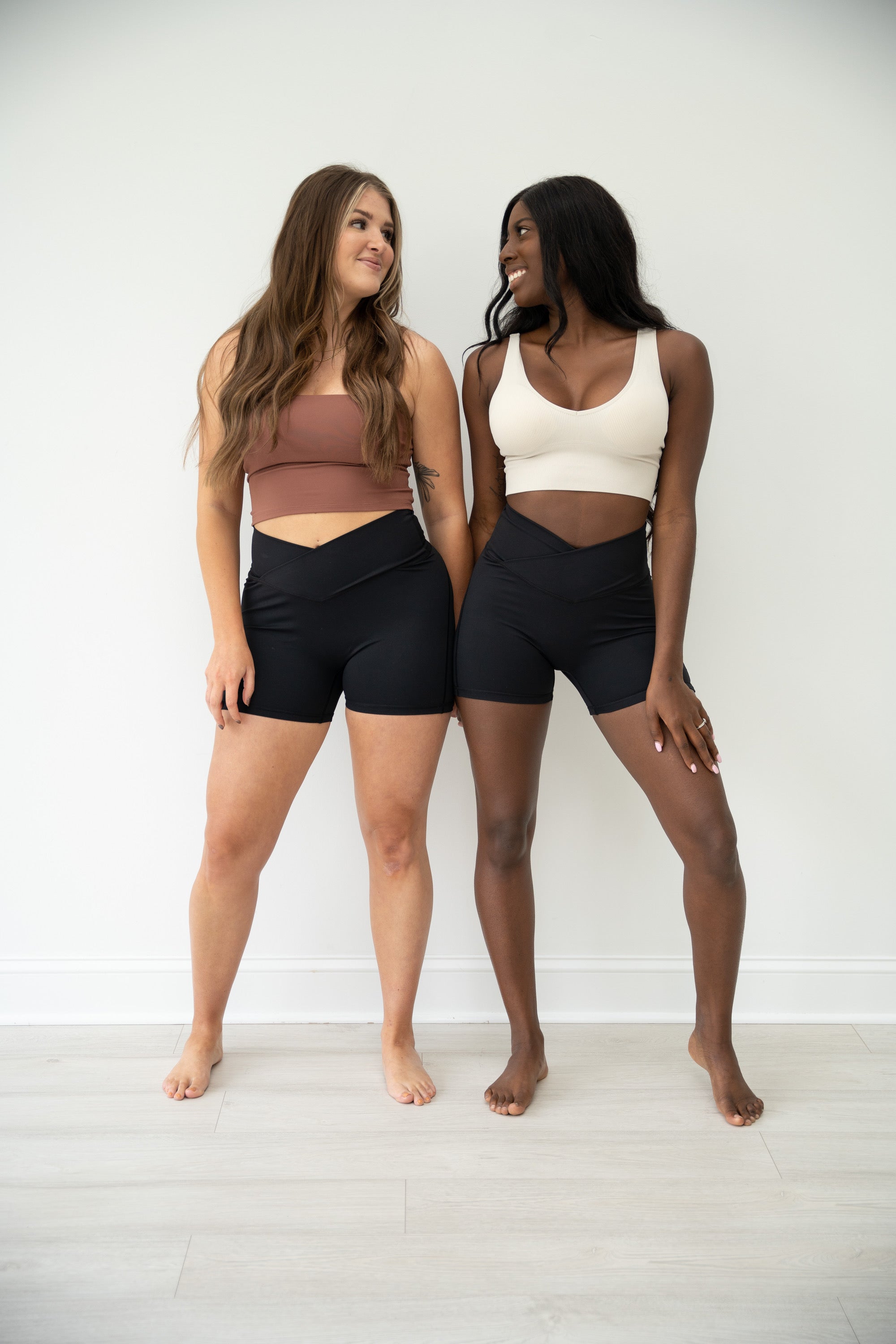 Brown LUMINOUS Crossover waist shorts with two side pockets & ruched booty.