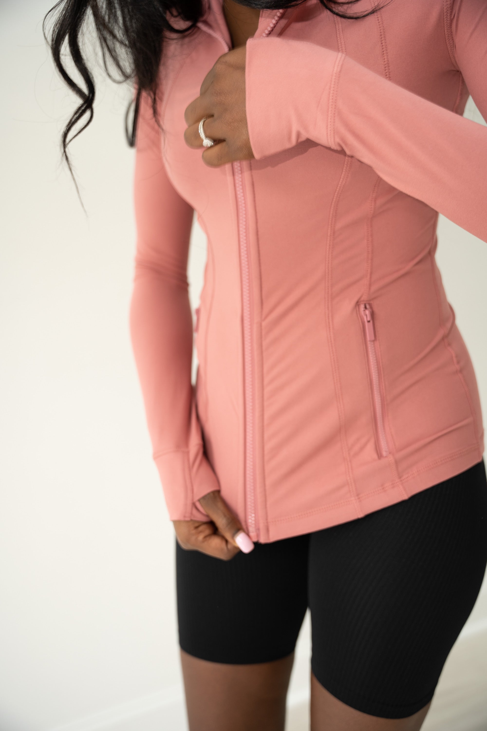 Rose Mock-Neck active jacket with thumbholes and full-length zipper.