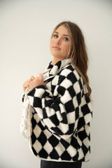 Black & White checkered sherpa jacket with full snap closure.